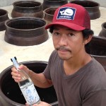 Ken Hirata holding a bottle of Sochu