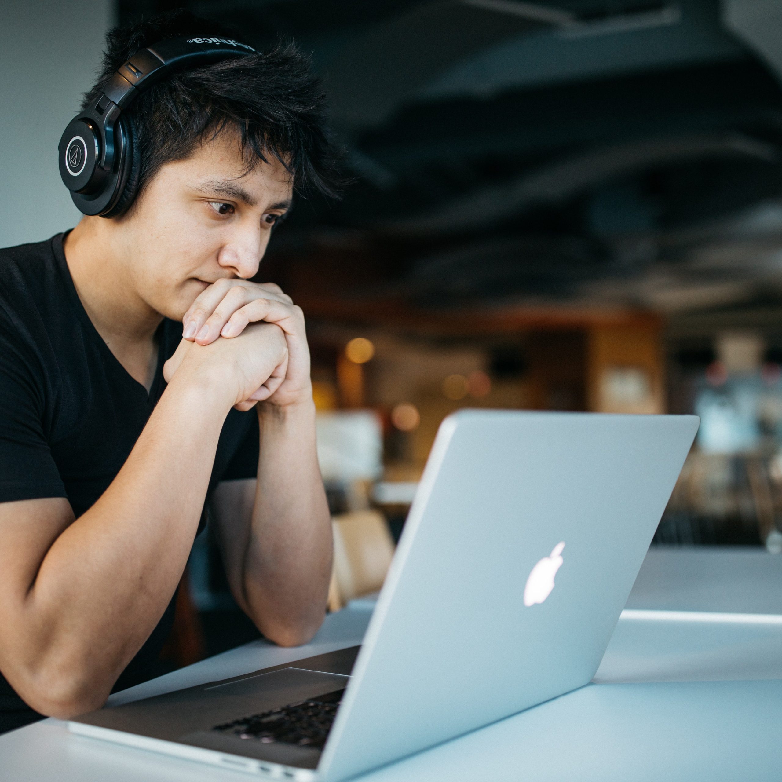 Man with headphones at laptop