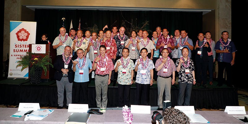 Group of folks posing at the Japan Hawaii summit